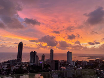 Cityscape against sky during sunset