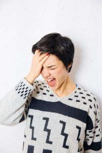 Young woman against white background