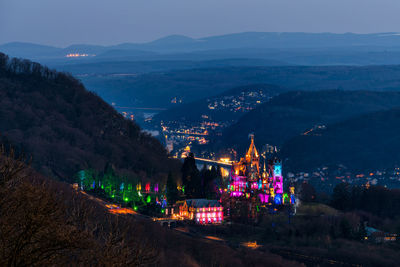 High angle view of illuminated buildings in city at night