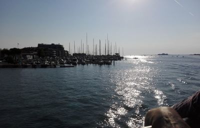 Sailboats in sea against clear sky