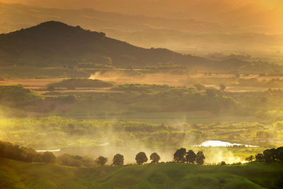 Scenic view of landscape against sky during sunset