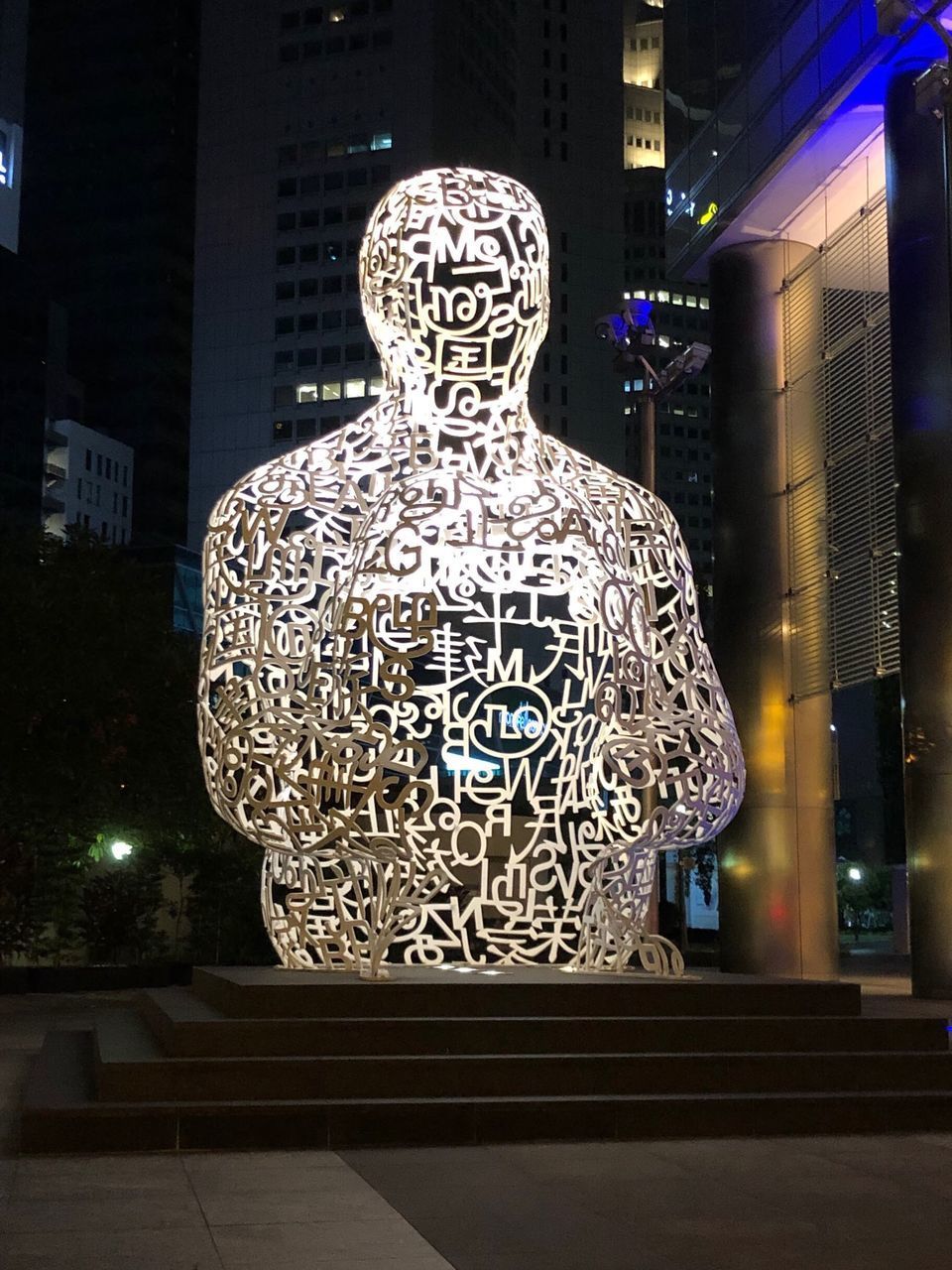 VIEW OF ILLUMINATED STATUE OF STORE