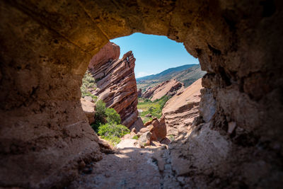 View of rock formations through cave