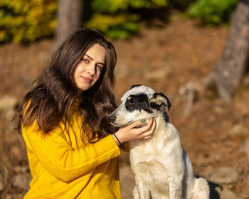Portrait of teenage girl with dog