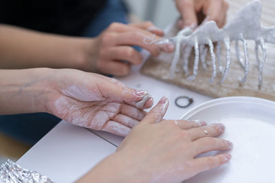 Cropped hands of person washing hand