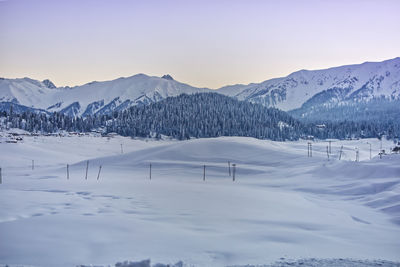 Scenic view of snow covered mountains against sky, gulmarg kashmir 2021