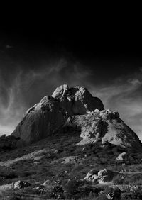 Low angle view of snowcapped mountain against sky