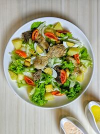 High angle view of salad in bowl on table