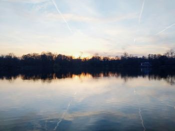 Scenic view of lake against sky during sunset