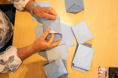 High angle view of people working on table