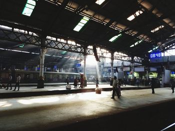 People waiting at railroad station