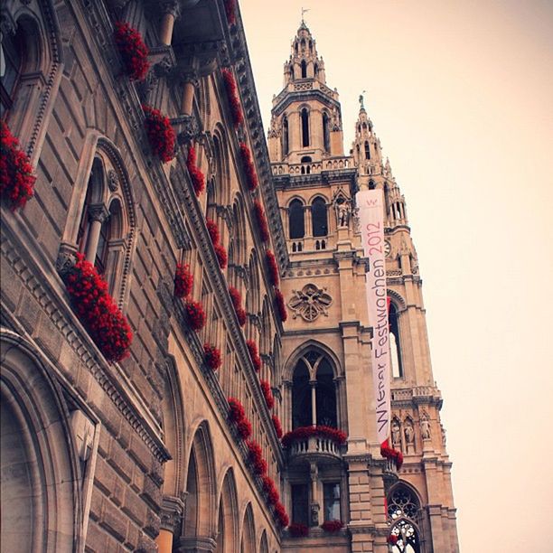 architecture, building exterior, built structure, religion, church, place of worship, low angle view, spirituality, cathedral, travel destinations, famous place, clock tower, history, city, arch, travel, sky, tourism