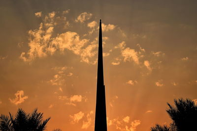 Low angle view of silhouette trees against sky during sunset