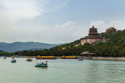 Scenic view of building against cloudy sky