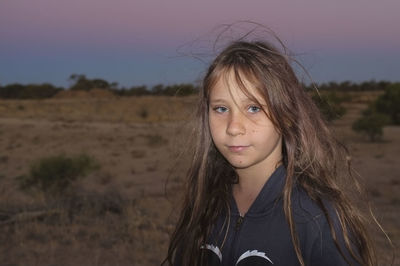 Portrait of girl against landscape