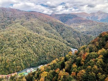 High angle view of trees and mountains against sky