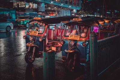 Illuminated city street at night