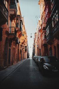 Narrow alley amidst buildings in city