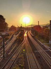 High angle view of railroad tracks against sky during sunset