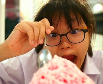 Close-up portrait of girl with ice cream