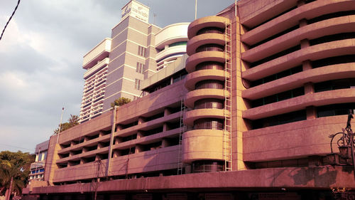 Modern building in city against sky