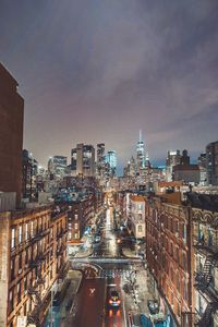 High angle view of city street and buildings against sky