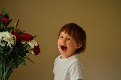 Portrait of boy against white background