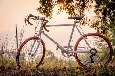 Bicycle parked on field