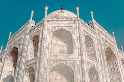 Low angle view of taj mahal against blue sky