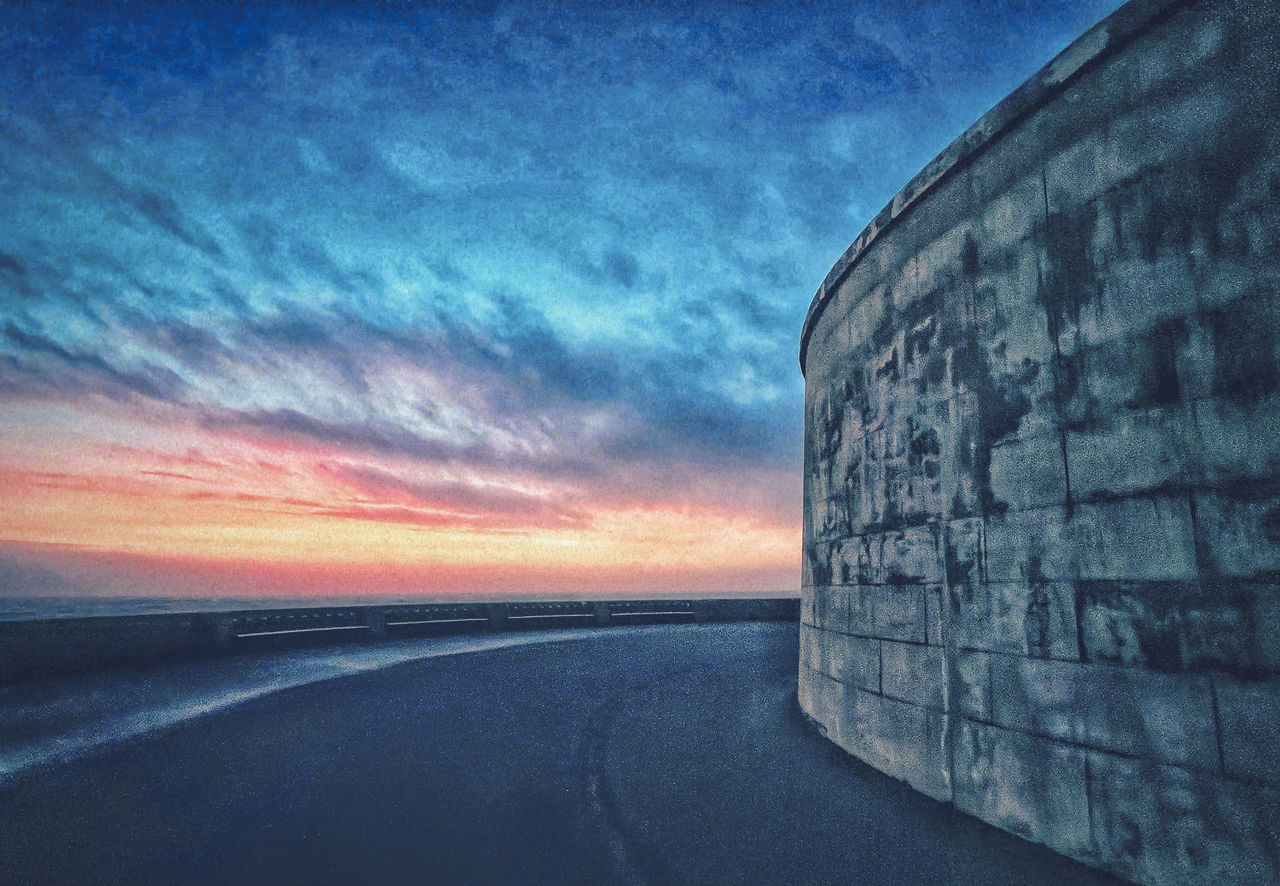 sky, cloud, horizon, sunset, blue, nature, transportation, water, no people, sea, road, dusk, architecture, reflection, beauty in nature, outdoors, scenics - nature, dramatic sky, darkness, horizon over water, the way forward, ocean