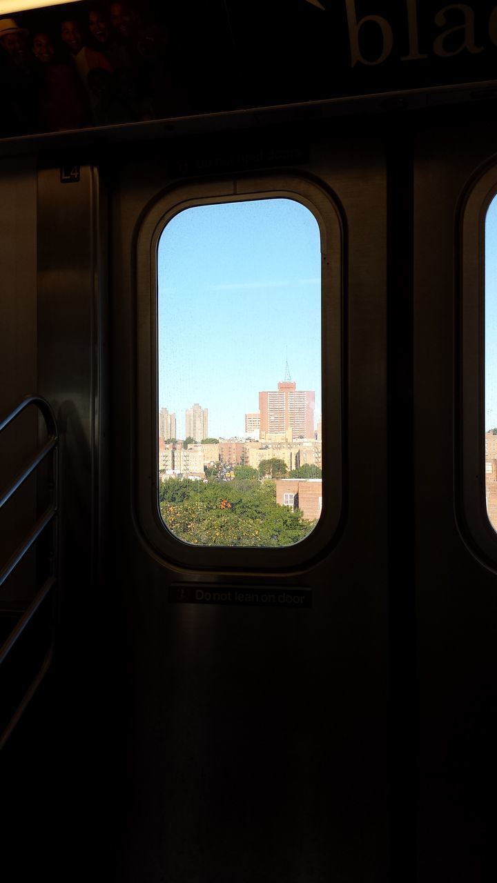 transportation, window, vehicle interior, indoors, glass - material, mode of transport, transparent, car, land vehicle, public transportation, travel, built structure, architecture, sky, windshield, tree, looking through window, day, car interior, reflection