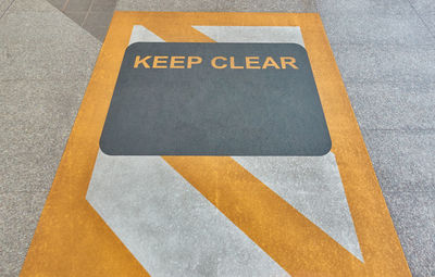 High angle view of arrow sign on road