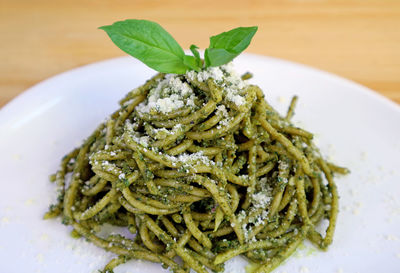Tasty and healthy homemade wholemeal spaghetti with pesto sauce