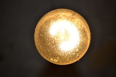 Close-up of illuminated light bulb