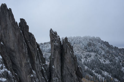 Panoramic view of snow covered land against sky