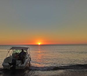 Scenic view of sea against clear sky during sunset