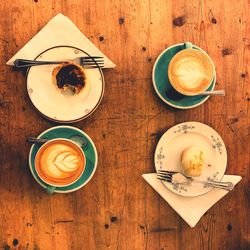 Directly above shot of cappuccino served on table