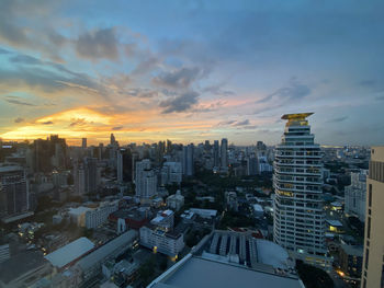 High angle view of buildings against sky during sunset