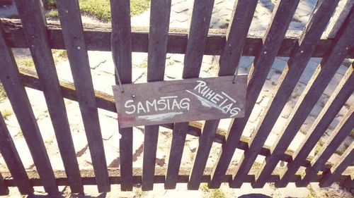 High angle view of text on fence