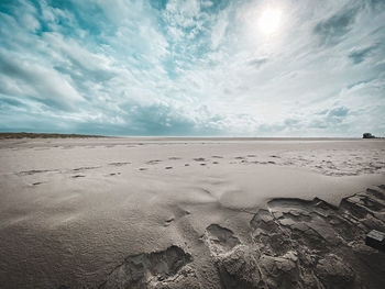 Scenic view of beach against sky