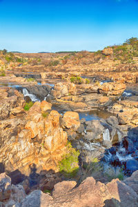 Scenic view of rock formation against sky