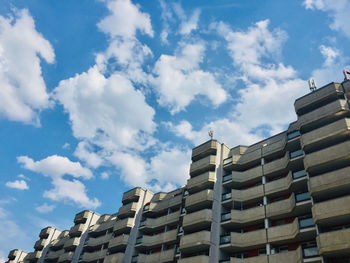 Low angle view of buildings against blue sky