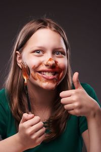 Close-up portrait of a smiling young woman