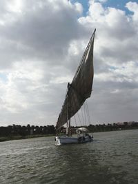 Ship in sea against sky