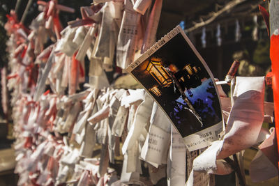 Clothes hanging on paper outdoors