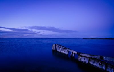Scenic view of sea against sky at sunset