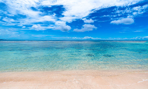 Scenic view of sea against blue sky