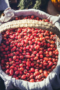 Red rosehips in a basket in the market