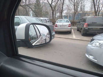 View of car on side-view mirror