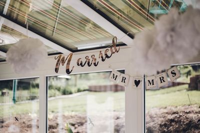 Information sign hanging on ceiling of building